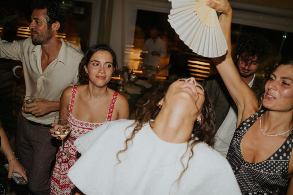 Masseria San Paolo Grande Wedding: Yasemin & Omer's Ostuni Celebration 37 Guests dancing at the welcome dinner at Ostuni a Mare