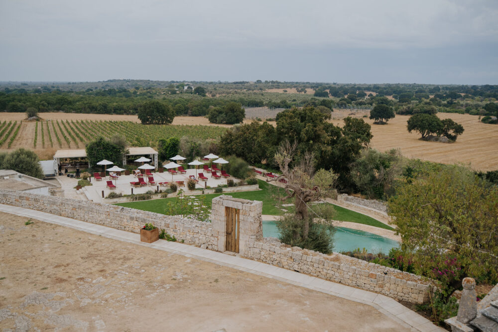 Masseria San Paolo Grande Wedding: Yasemin & Omer's Ostuni Celebration 22 Aerial view of Masseria San Paolo Grande's gardens, pool and the surrounding Puglian countryside