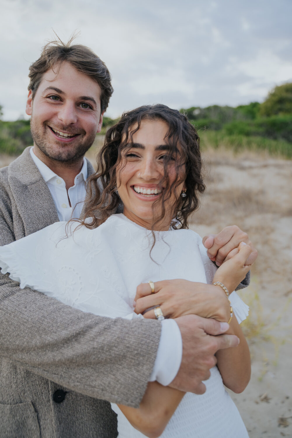 Masseria San Paolo Grande Wedding: Yasemin & Omer's Ostuni Celebration 30 Bride walking along the sand dunes at Ostuni a Mare
