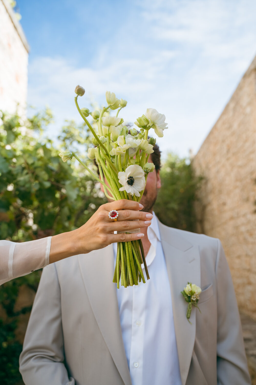 Masseria San Paolo Grande Wedding: Yasemin & Omer's Ostuni Celebration 46 Bride and groom portrait near the estate's stone chapel at Masseria San Paolo Grande