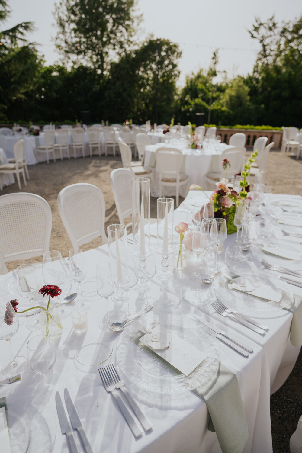 Elegant table setting with crystal glassware, taper candles and a wax-sealed menu card