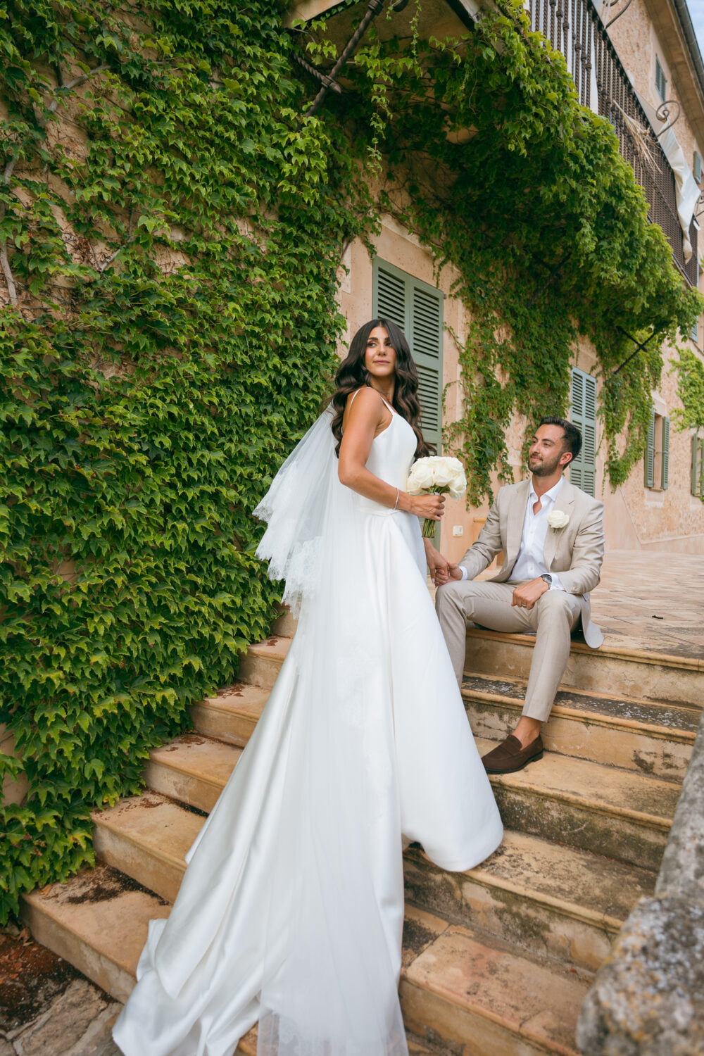 Jewish Wedding at Finca Son Mir, Mallorca 6 Bride walking through the stone archway at Finca Son Mir wedding venue, Mallorca